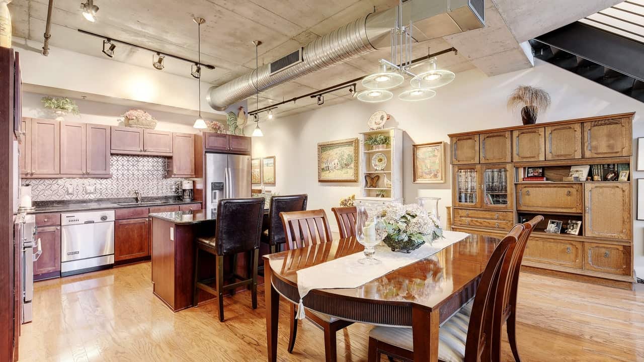 dining room area hard wood floor kitchen austin city lofts downtown condo storage