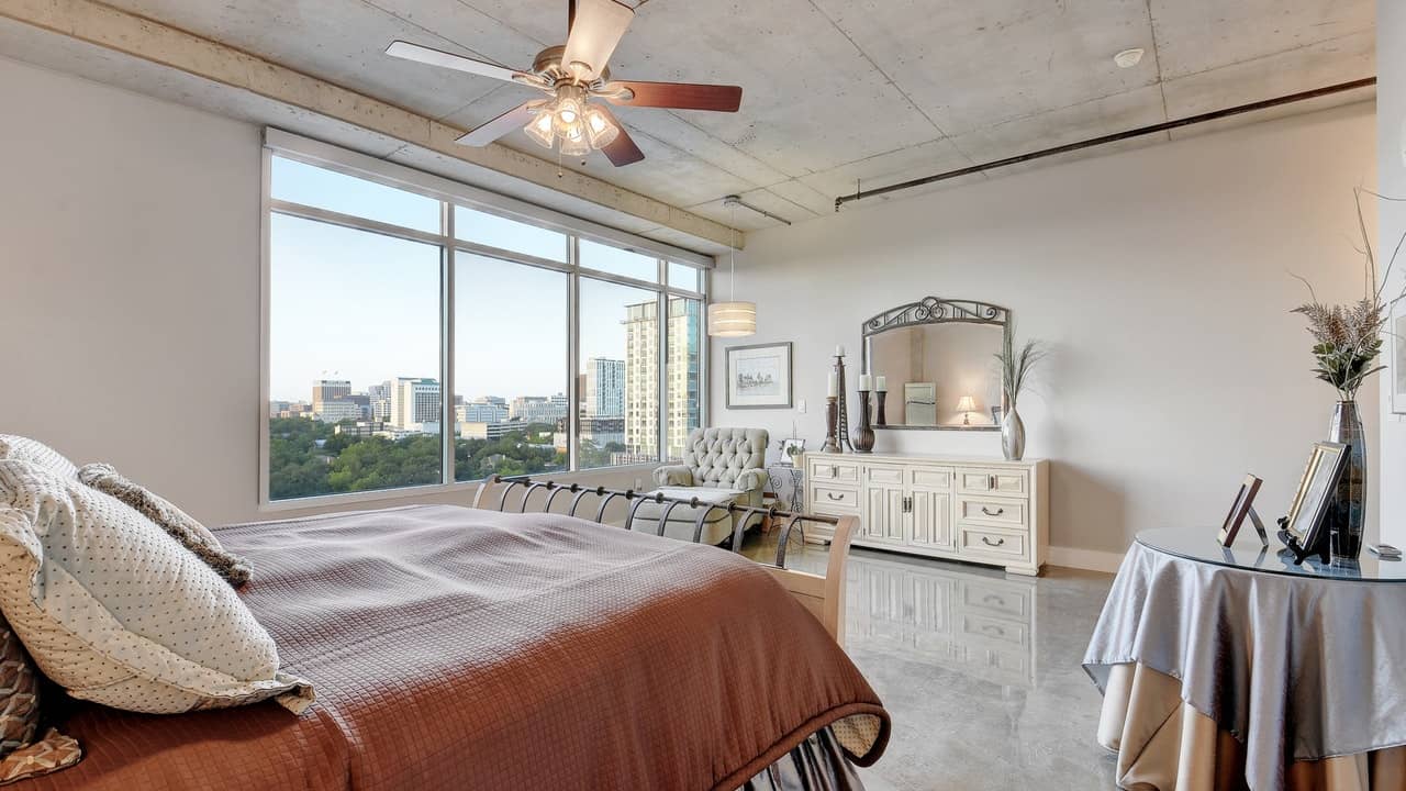 spacious bedroom master big windows austin city lofts downtown condo