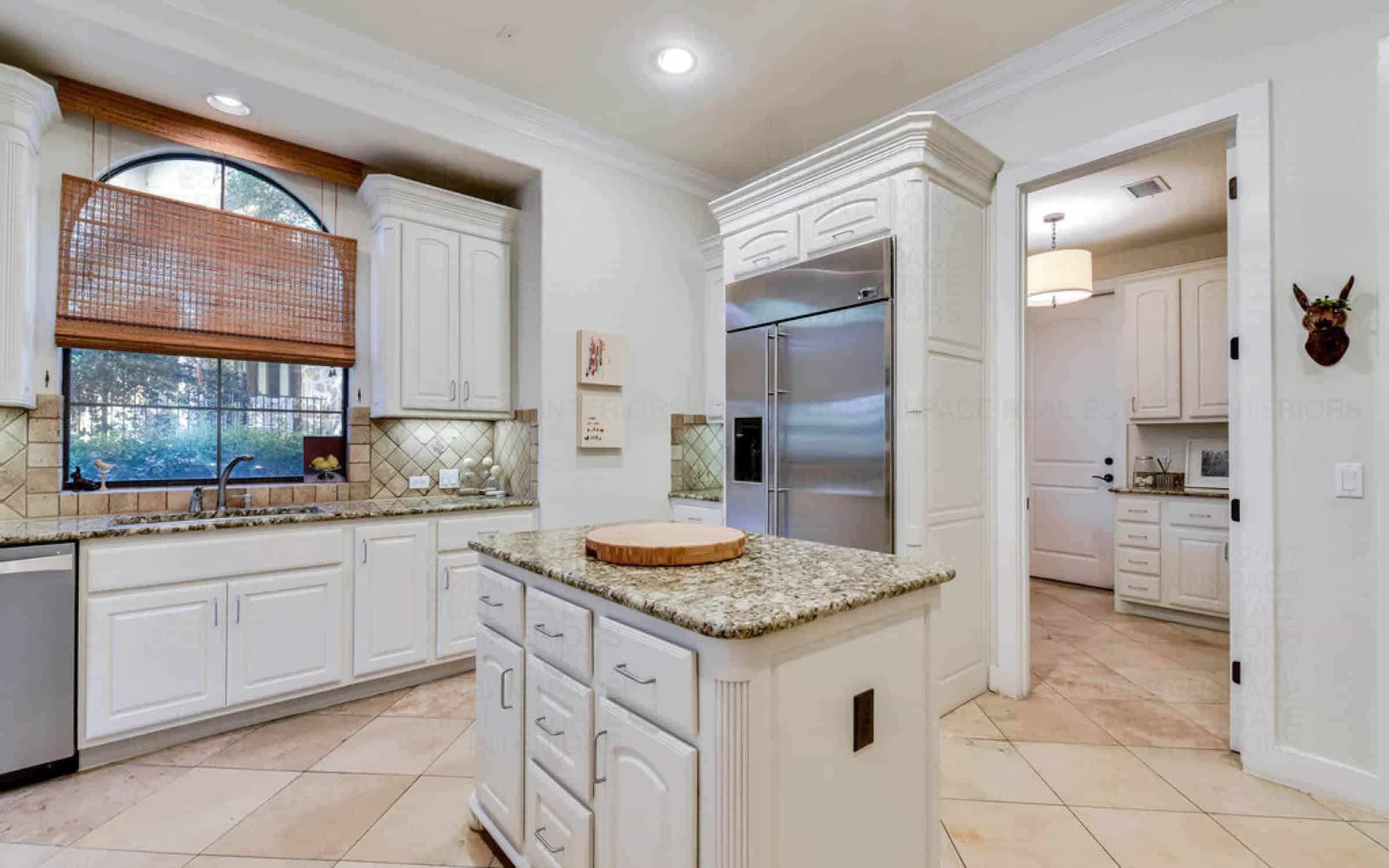 kitchen window over sink washroom stainless steel appliances white liberty park austin house